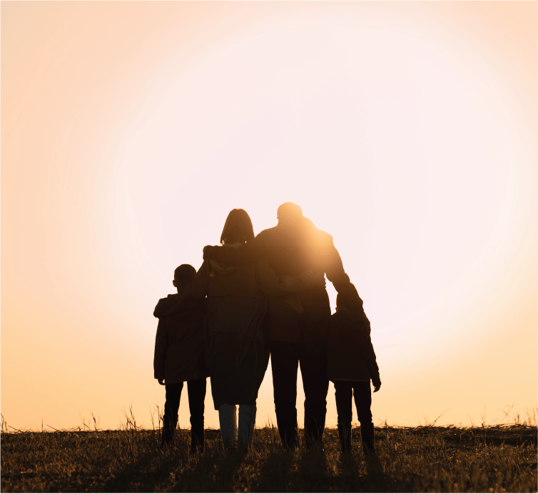 Family standing together at sunrise in Benoni, symbolizing beginnings and emotional support offered through family counseling.